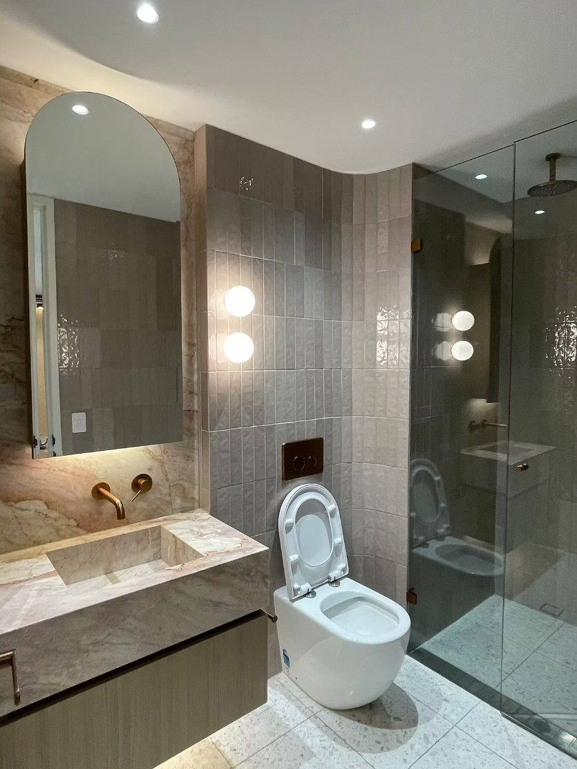 Bathroom vanity and toilet cleaned for handover in a new Bondi apartment