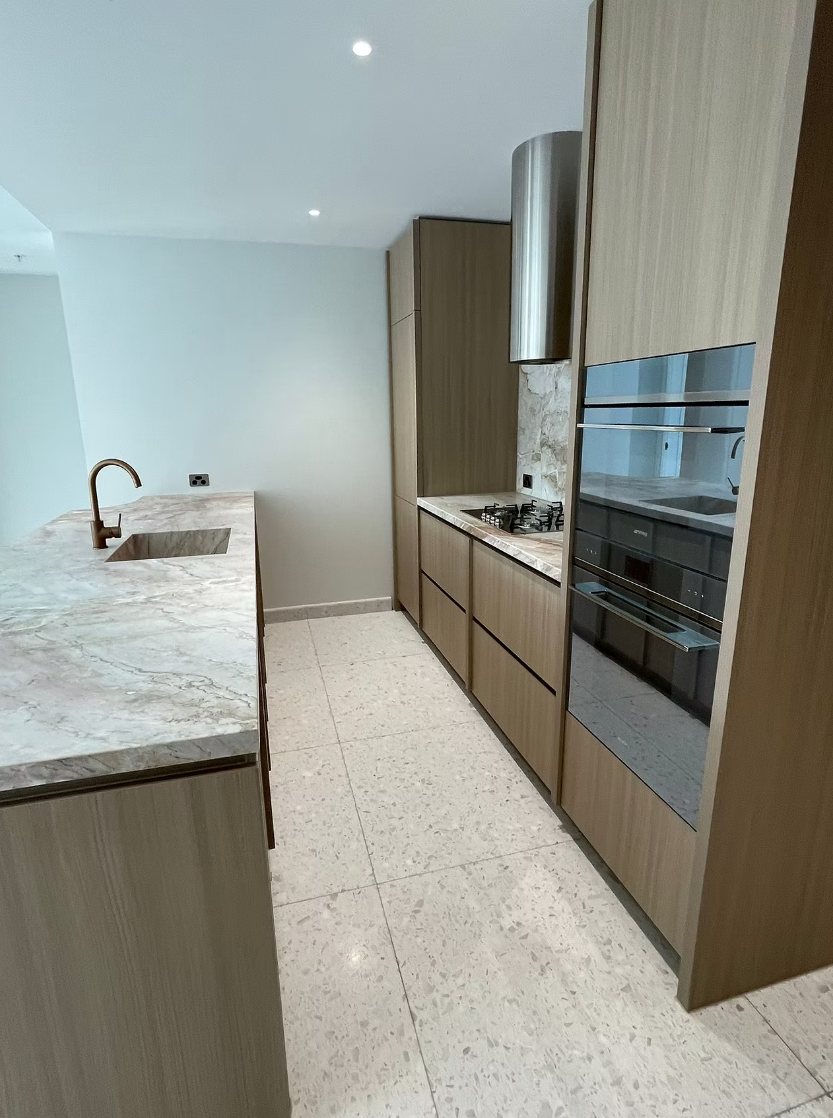 Galley kitchen in a new Bondi apartment after the final clean