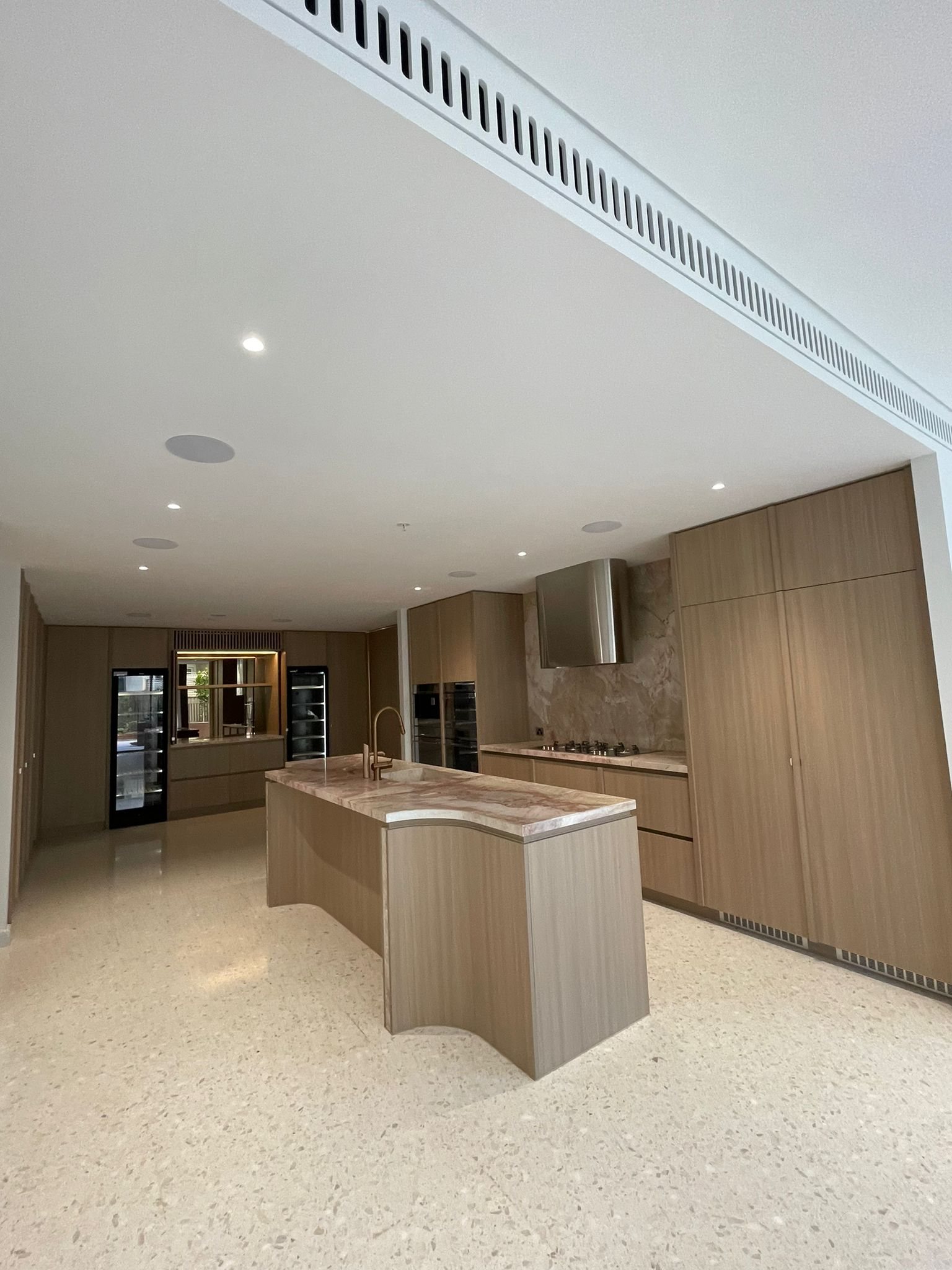 Handover-ready kitchen and living area after an M&I post-construction clean