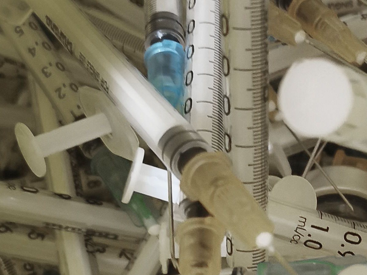Used syringes and needles: sharps go in a sharps container, never a clinical waste bag