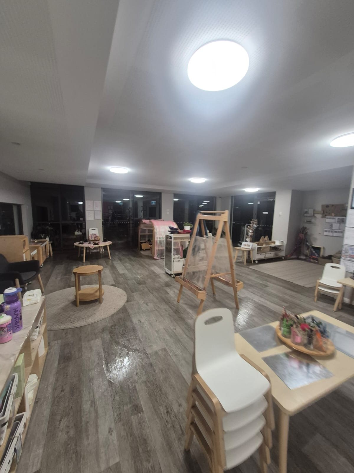 Open-plan early learning space with timber furniture, floors cleaned