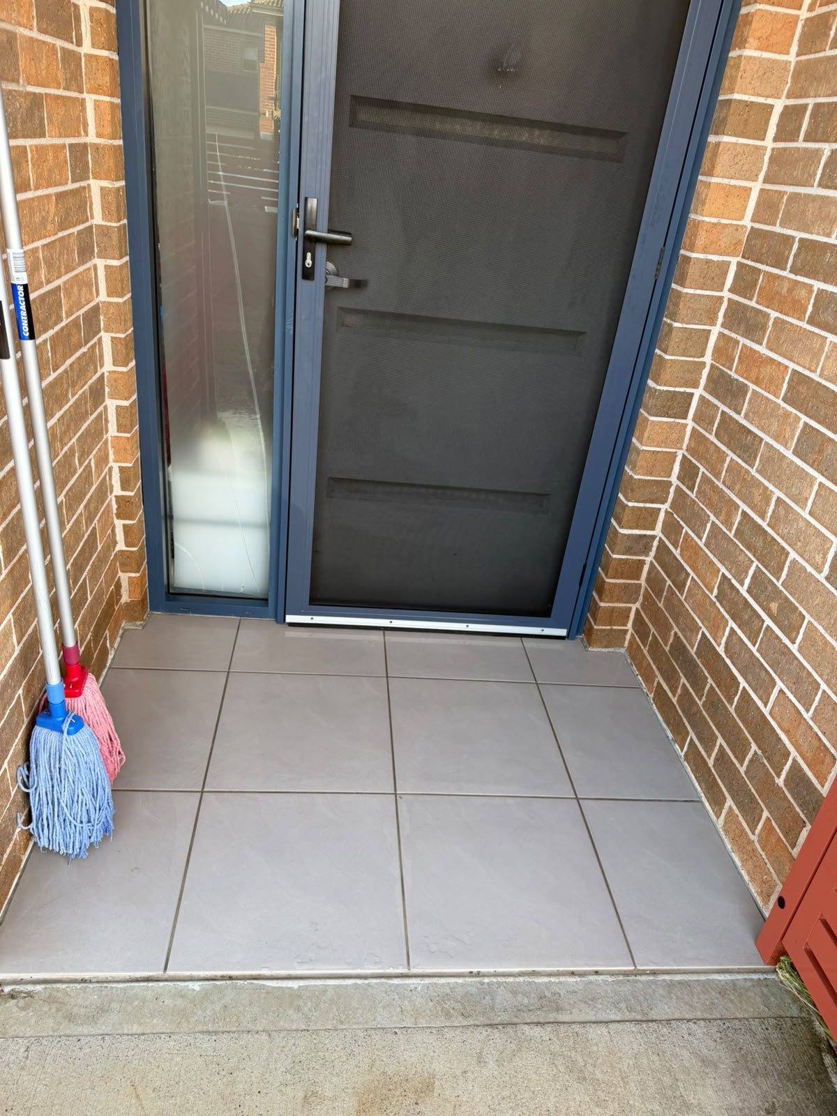 Townhouse entry and tiled landing swept and mopped